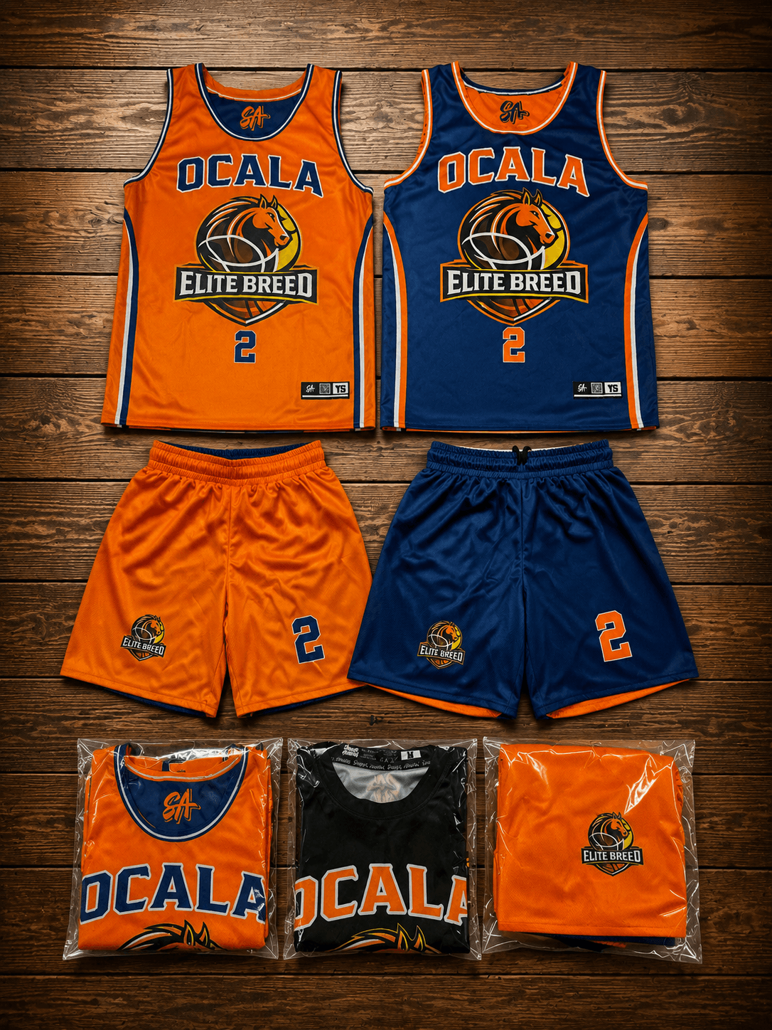 Orange and navy Ocala Elite Breed basketball uniforms with matching shorts.
