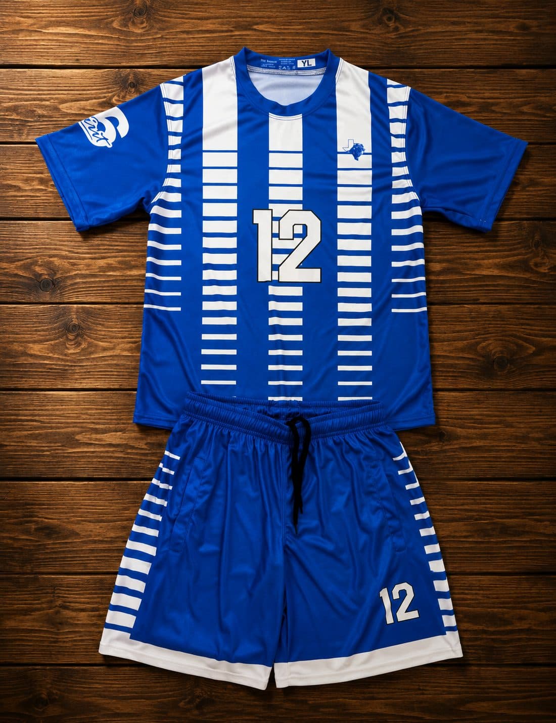 Custom sublimated soccer kit - royal blue and white youth jersey and shorts made by Slugger Athletics