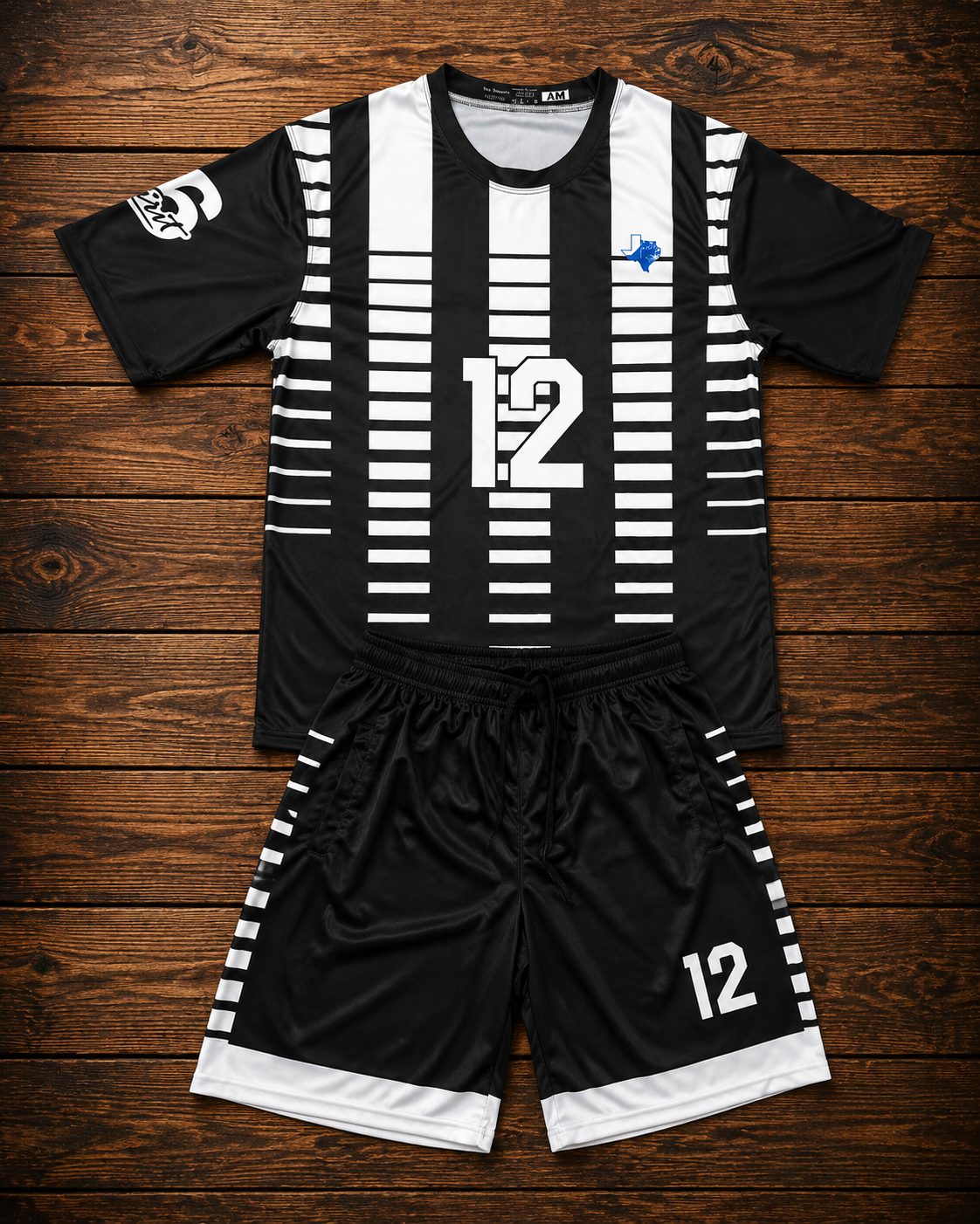 Custom sublimated soccer kit, black and white striped jersey and shorts by Slugger Athletics